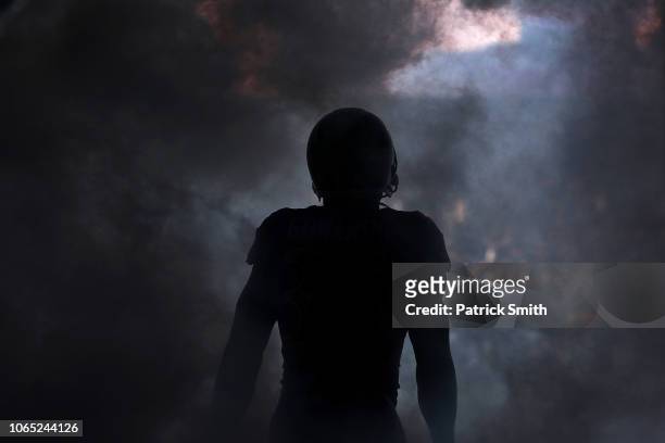 Running back Gus Edwards of the Baltimore Ravens is introduced before playing against the Oakland Raiders at M&T Bank Stadium on November 25, 2018 in...