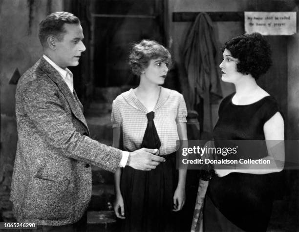 Actress Blanche Sweet, Edward Earle and Dorothy Sebastian in a scene from the movie "Why Women Love"