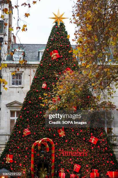 Christmas tree decorated with presents and lights is seen outside Annabel's Ð a Birley Club in Mayfair.