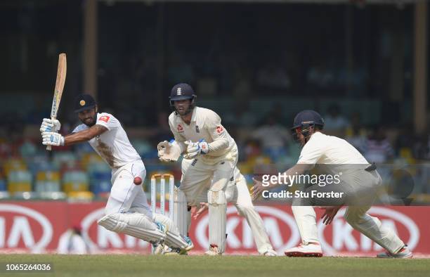 Sri Lanka batsman Roshen Silva picks up some runs past Keaton Jennings during Day Four of the Third Test match between Sri Lanka and England at...