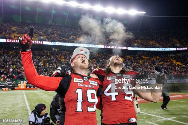 Quarterback Bo Levi Mitchell and Alex Singleton of the Calgary Stampeders celebrate their victory against the Ottawa Redblacks during the Grey Cup...