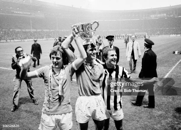 Left to right Peter Barnes, Dave Watson and Dennis Tueart of Mancester City with the League Cup trophy after their 2-1 victory over Newcastle United...