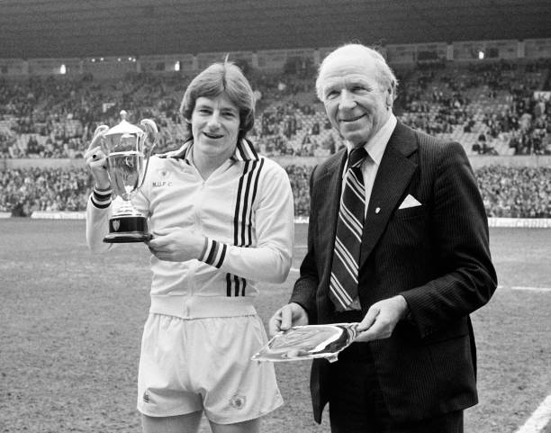 Steve Coppell receives the Manchester United Player of the Year award from Sir Matt Busby at Old Trafford, Manchester on 22nd April 1978.
