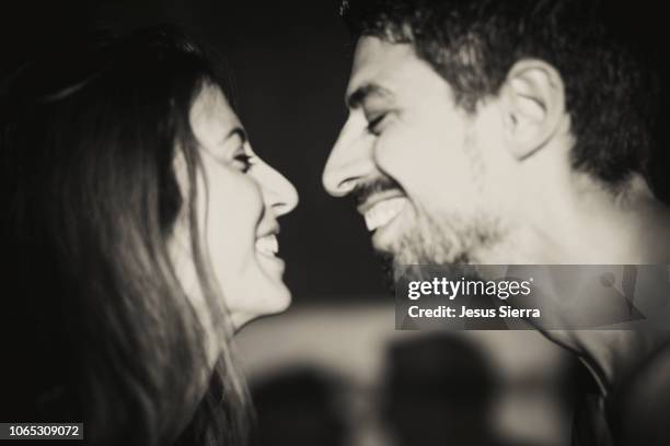 young couple smiling at each other, close up - woman body contour standing bildbanksfoton och bilder