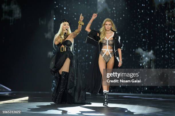 Rita Ora performs as Stella Maxwell walks the runway during the 2018 Victoria's Secret Fashion Show at Pier 94 on November 08, 2018 in New York City.