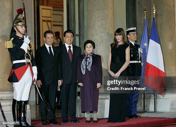 French President Nicolas Sarkozy , Chinese President Hu Jintao , Chinese First Lady Liu Yongqing and French First Lady Carla Bruni Sarkozy at a state...