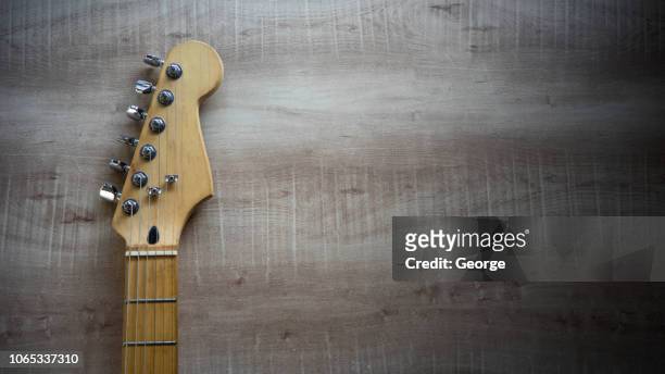 vintage guitar on wooden background - country and western music stock pictures, royalty-free photos & images