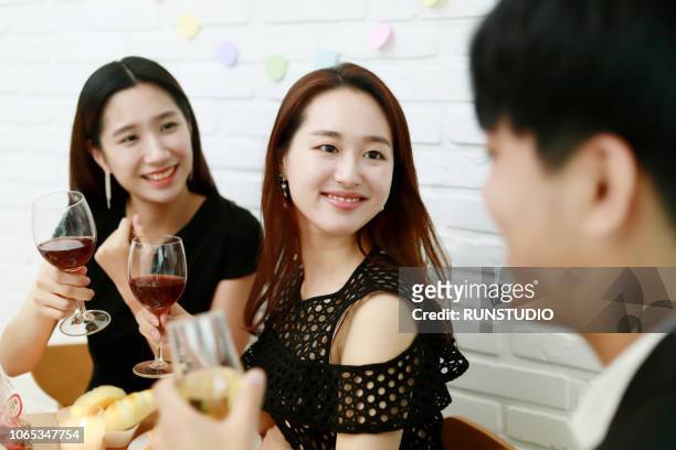 friends drinking wine and enjoying party - restaurant night ストックフォトと画像