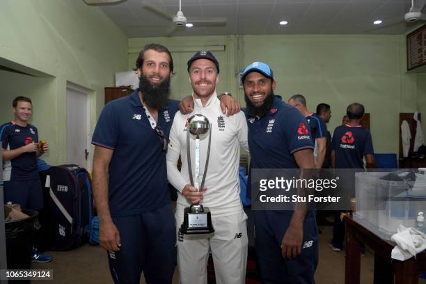 England spinners Moeen Ali, Jack Leach and Adil Rashid celebrate with the trophy in the dressing room after their 3-0 series victory during Day Four...