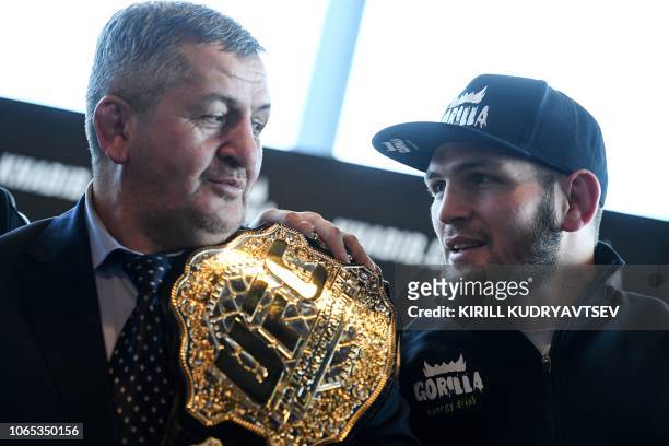 Mixed martial arts fighter Khabib Nurmagomedov and and his father Abdulmanap Nurmagomedov give a press conference in Moscow on November 26, 2018.