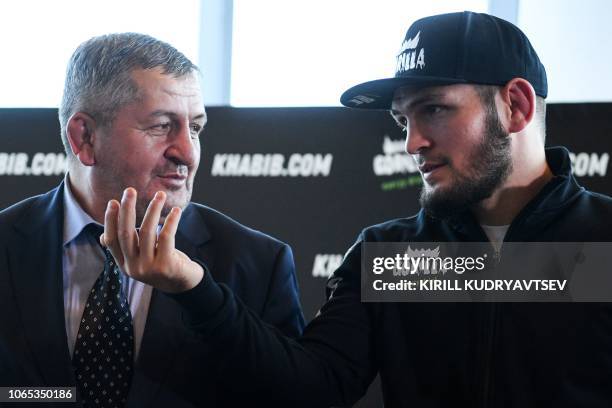 Mixed martial arts fighter Khabib Nurmagomedov and and his father Abdulmanap Nurmagomedov give a press conference in Moscow on November 26, 2018.