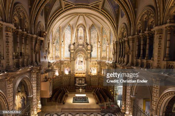 Inside of the basilica of the abbey Montserrat. The statue of the black Madonna is visible in the upper part of the frame, which tourists and...