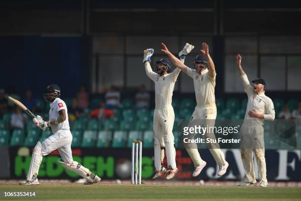 England players left to right short leg fielder Keaton Jennings and Ben Foakes appeal with success for the final wicket of Suranga Lakmal after...