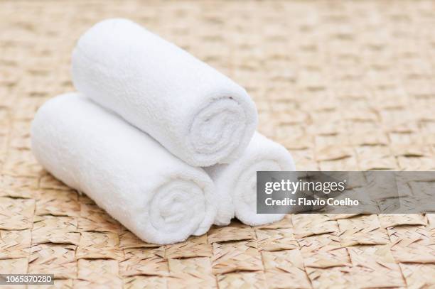 white towels on large mat - towel ストックフォトと画像