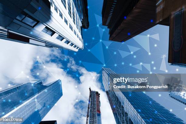 smart cityscape high-technology blue tone connected, wireless communication network, abstract image visual - smart building stock pictures, royalty-free photos & images