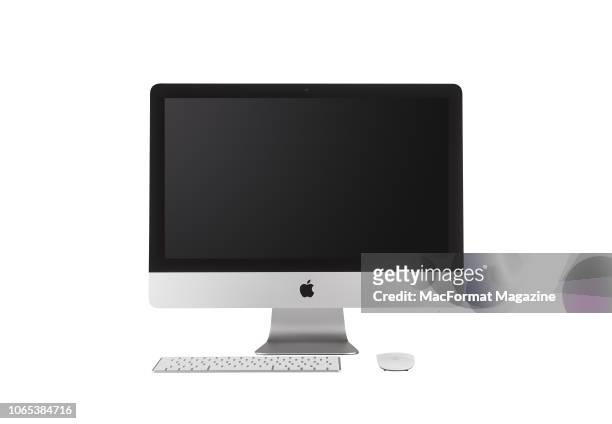 Inch Apple iMac with Retina 4K display alongside a wireless Apple Magic Keyboard and Magic Mouse 2, taken on June 23, 2017.
