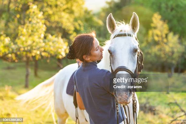 bonding with horse - horse stock pictures, royalty-free photos & images