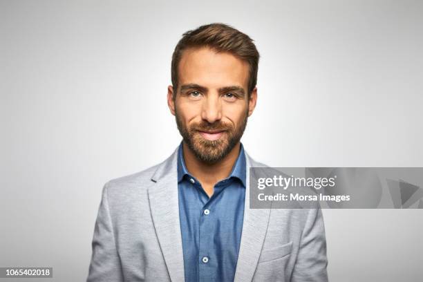 portrait of handsome young businessman - white jacket stock pictures, royalty-free photos & images