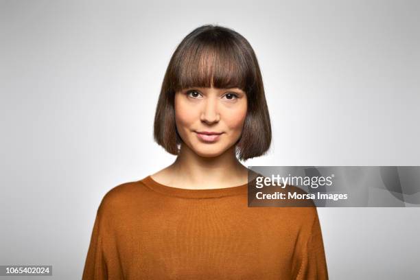 portrait of beautiful young businesswoman - brown hair white background stock pictures, royalty-free photos & images