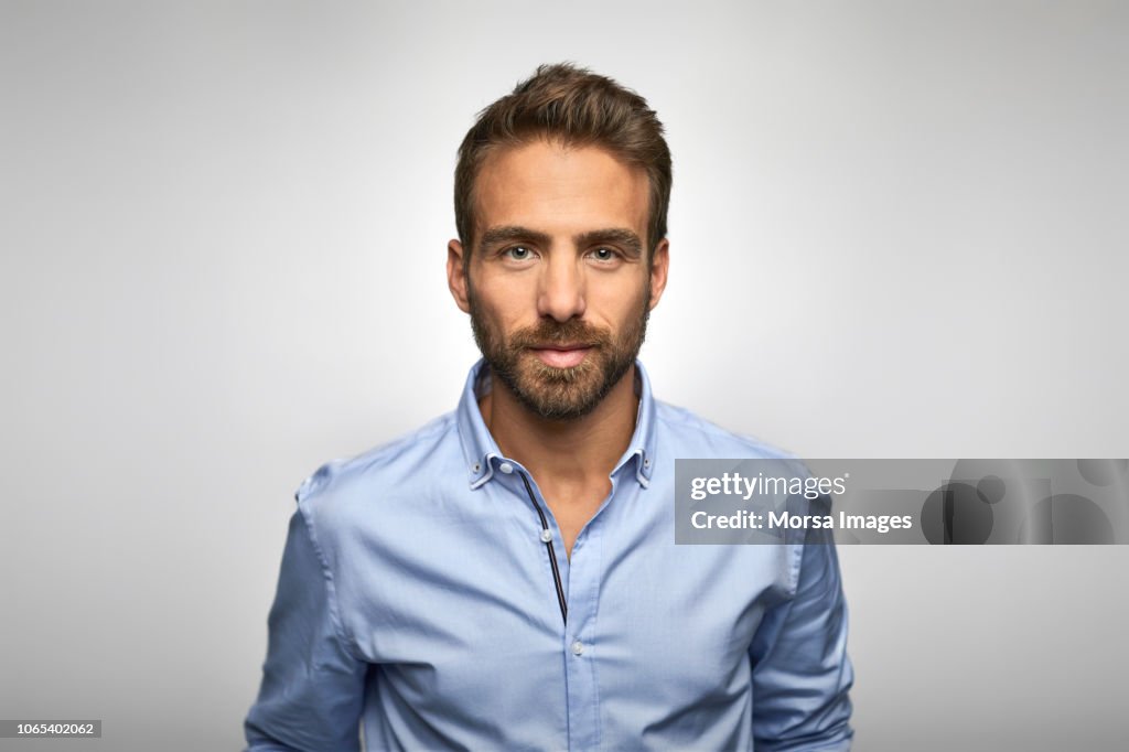 Portrait of young businessman wearing blue shirt