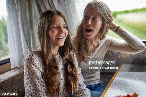 surprised mother with daughter in a caravan - surprised mum stock pictures, royalty-free photos & images