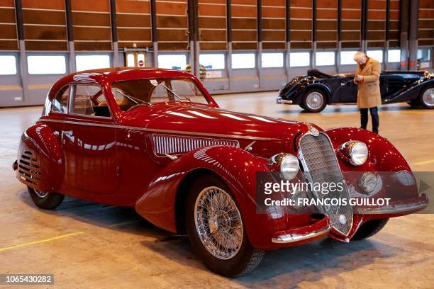 Photo taken on November 26, 208 shows a 1939 Alfa Romeo 8C 2900B on display in Orly, outside of Paris, ahead of the "Retromobile 2019" auction by the...