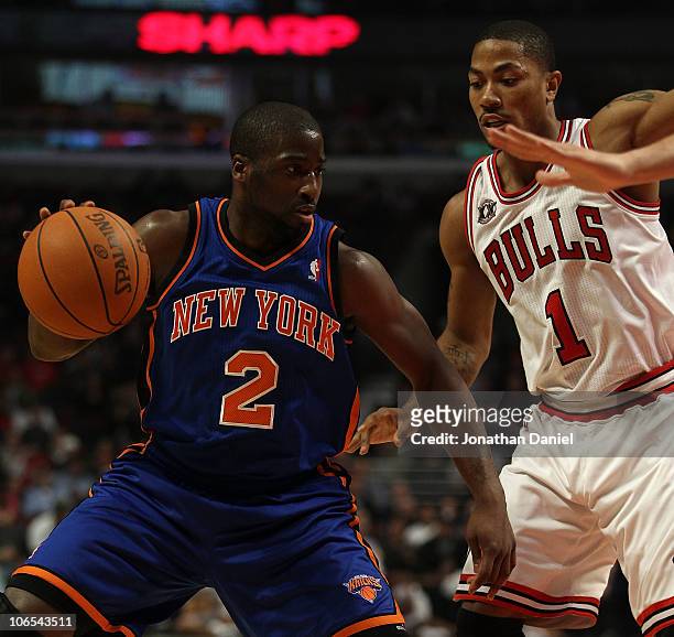 Raymond Felton of the New York Knicks moves against Derrick Rose of the Chicago Bulls at the United Center on November 4, 2010 in Chicago, Illinois....