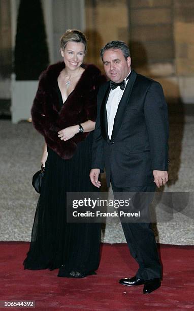 Secretary General of UMP Xavier Bertrand arrives with his wife Emmanuelle Gontier to attend a state dinner honouring visiting Chinese President Hu...