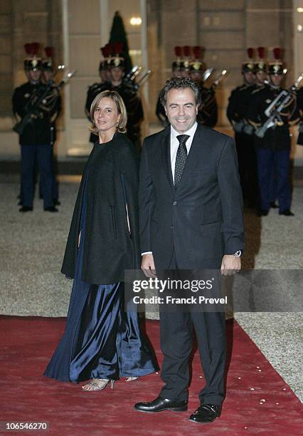 French Education Minister Luc Chatel and his wife arrives to attend a state dinner honouring visiting Chinese President Hu Jintao at Elysee Palace on...