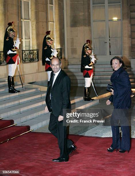 French Labor Minister Eric Woerth arrives with his wife Florence arrives to attend a state dinner honouring visiting Chinese President Hu Jintao at...