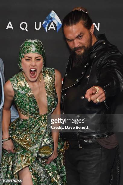 Amber Heard and Jason Momoa attend the World Premiere of "Aquaman" at Cineworld Leicester Square on November 26, 2018 in London, England.