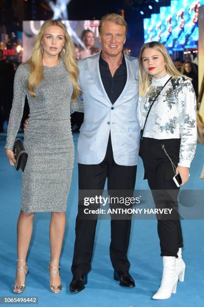 Swedish actor Dolph Lundgren , Ida Lundgren and Greta Lundgren pose upon arrival to attend the World Premiere of the film "Aquaman" in London on...