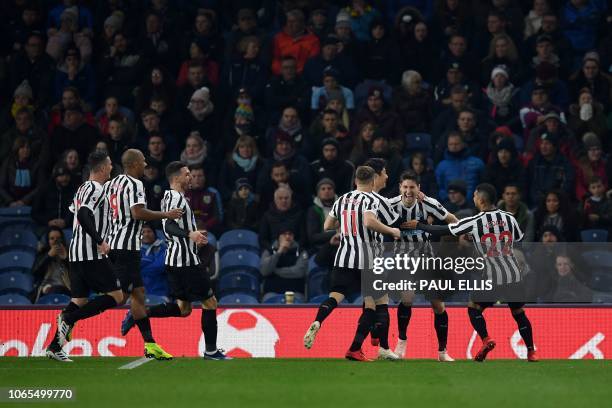 Newcastle United's Argentinian defender Federico Fernandez celebrates after his shot was deflected in off of Burnley's English defender Ben Mee to...