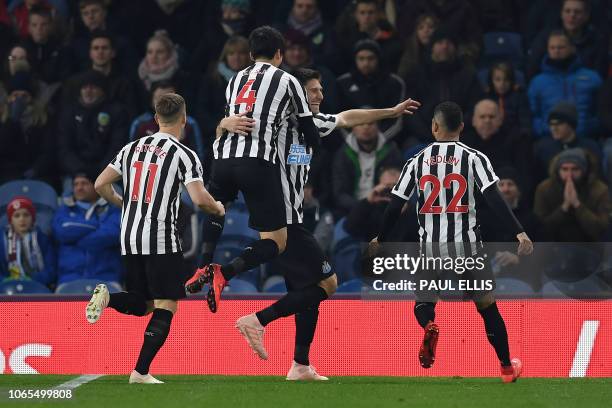 Newcastle United's Argentinian defender Federico Fernandez celebrates after his shot was deflected in off of Burnley's English defender Ben Mee to...