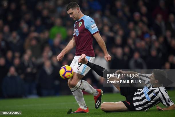 Newcastle United's Argentinian defender Federico Fernandez vies with Burnley's Welsh striker Sam Vokes during the English Premier League football...