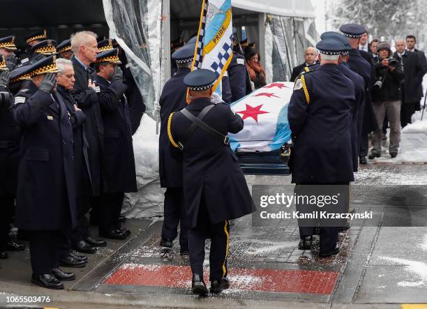 Chicago Police Superintendent Eddie Johnson , Chicago Mayor Rahm Emanuel and Illinois Governor Bruce Rauner salute as the casket of slain Chicago...