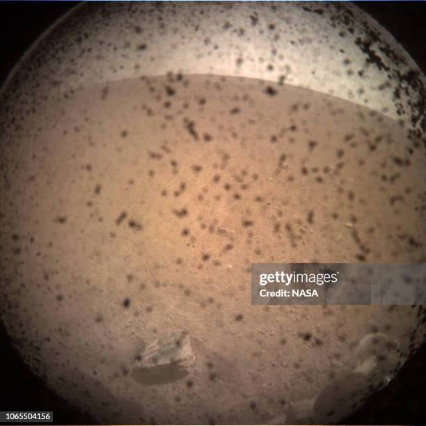 In this handout provided by NASA, NASA’s InSight lander returns its first image taken on the surface of Mars on November 26, 2018. The instrument...