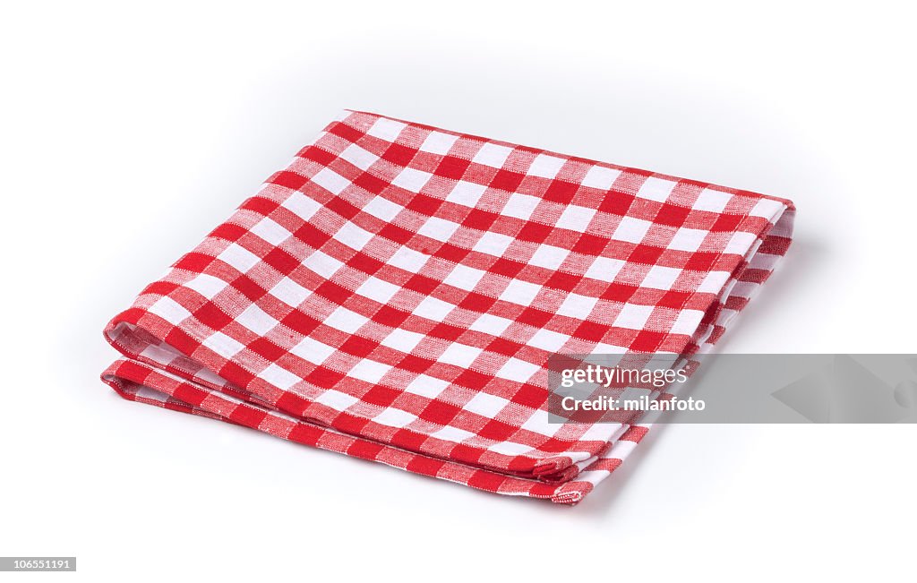 Red and white gingham tea towel on white background