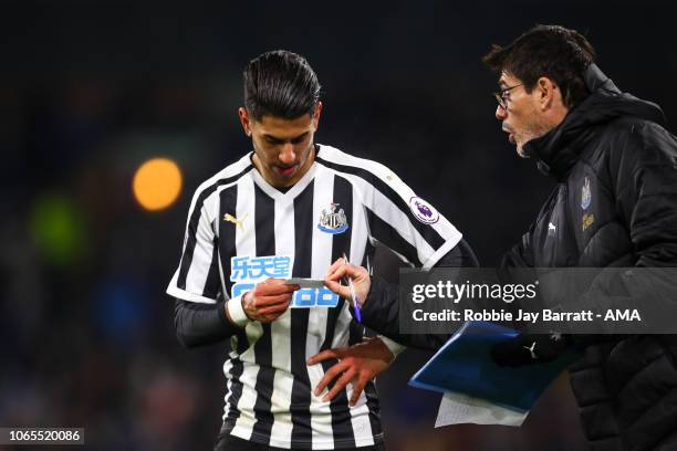 Ayoze Perez of Newcastle United is passed a note by Mikel Antia assistant head coach / manager of Newcastle United during the Premier League match...