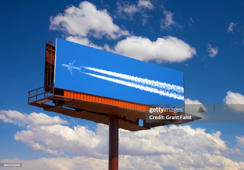 Photograph of airplane on billboard.