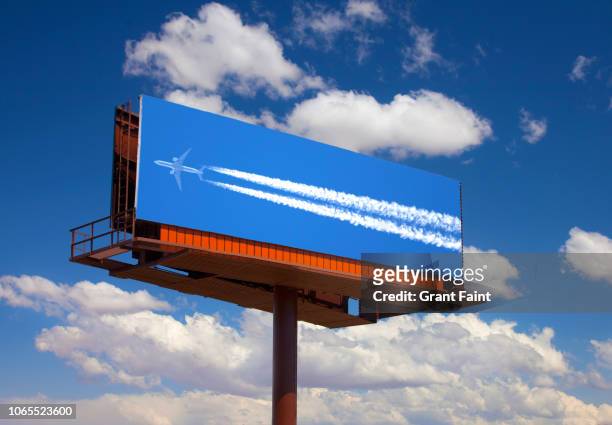 photograph of airplane on billboard. - advertisement stock pictures, royalty-free photos & images