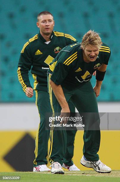 Shane Watson of Australia grimaces after being hit in the leg by a throw at the stumps by Michael Clarke of Australia during the Commonwealth Bank...