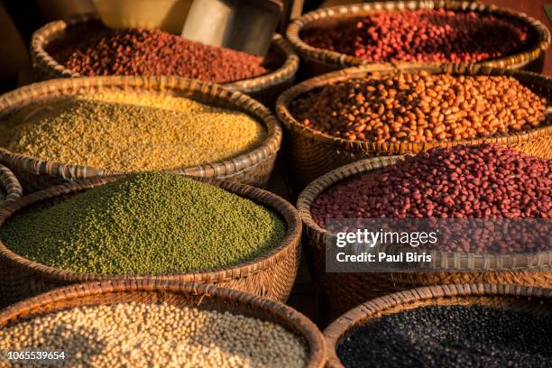 tropical colorful spices and legumes sold at a local market in hanoi, vietnam - spice market stock pictures, royalty-free photos & images