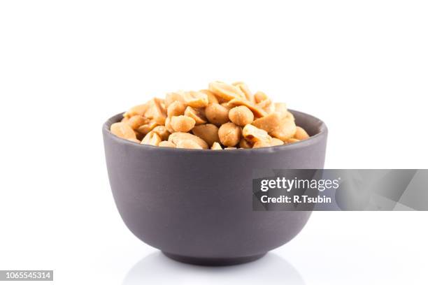 peanut nuts salt in bowl isolated on white background - salted bildbanksfoton och bilder