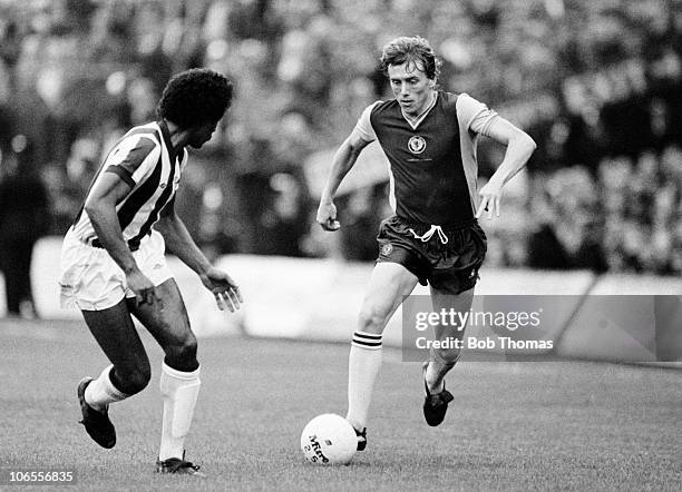 Tony Morley of Aston Villa takes on West Bromwich Albion defender Brendan Batson during their First Division match at the Hawthorns in West Bromwich,...