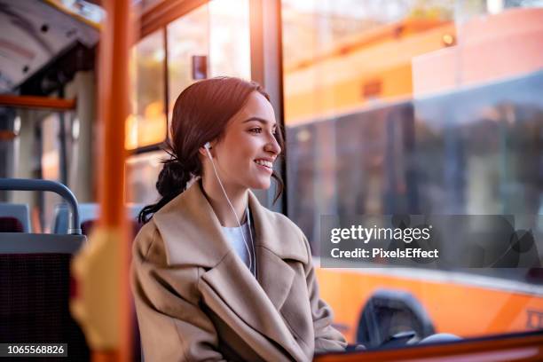 旅行する曲 - people using public transport ストックフォトと画像