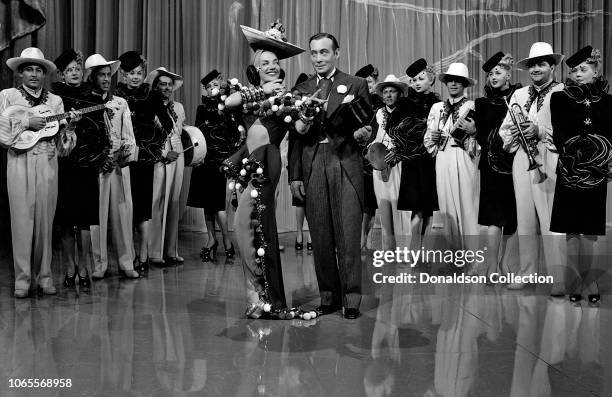 Actress Carmen Miranda and Phil Baker in a scene from the movie "The Gang's All Here"