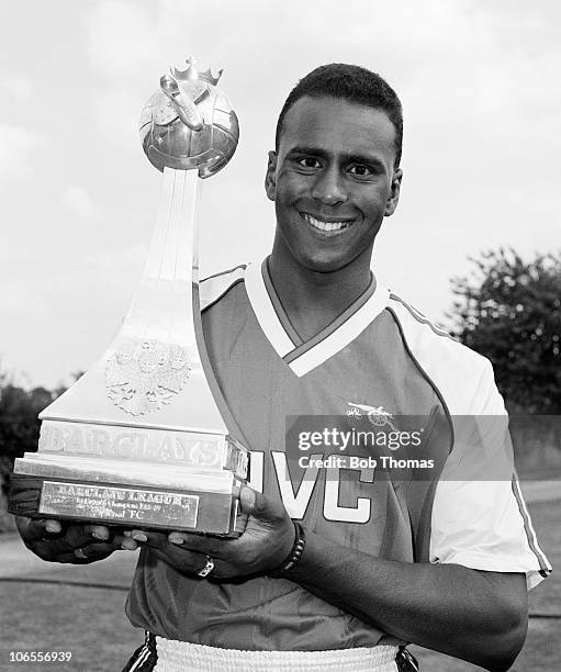David Rocastle of Arsenal with the Barclays Division One League Championship trophy during the team photo-call held in London, circa August 1989.