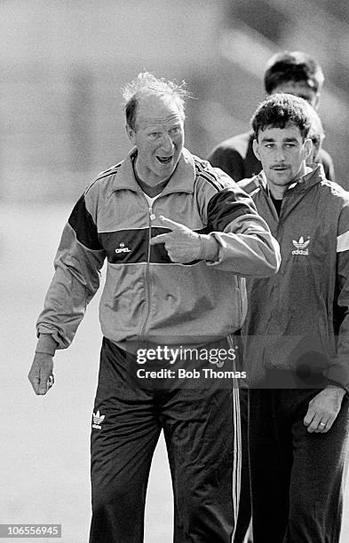 Republic of Ireland manager Jack Charlton watched by John Aldridge during a team training session in Dublin, Ireland on the 5th September 1989.