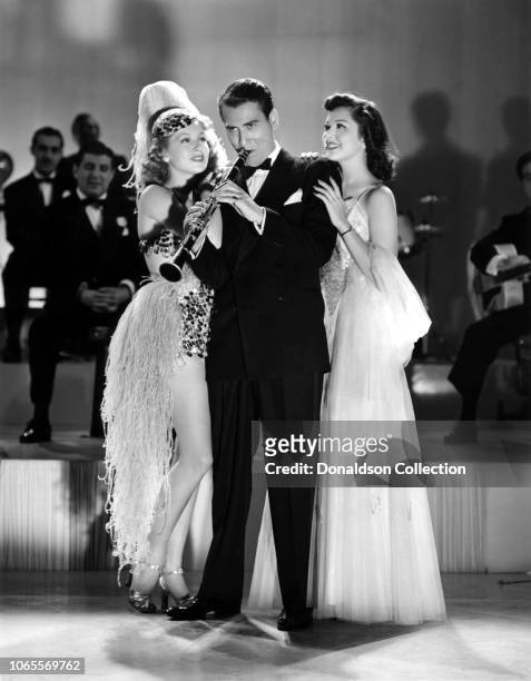 Actress Lana Turner, Ann Rutherford and Artie Shaw in a scene from the movie "Dancing Co Ed".